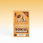 A retro-style tan and brown box of SOKA Espresso Concentrate sachets in the 'GOLDEN CARAMEL' flavour, with illustrations of coffee beans and characters, set against a warm orange gradient background.