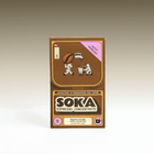 A box of SOKA Espresso Concentrate coffee sachets, featuring a brown and tan design with cartoon illustrations of coffee beans and characters, labeled with a purple 'NUTTY HAZELNUT' sticker, set against a neutral gradient background.