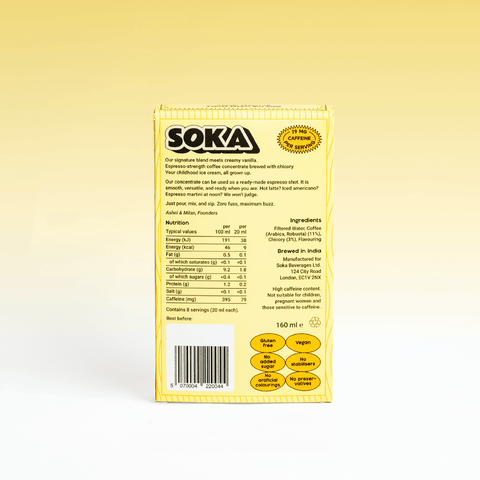 The back of a SOKA Espresso Concentrate box in yellow, showing product details, ingredients, and nutritional information of the French Vanilla flavour, photographed against a yellow-to-white gradient background.